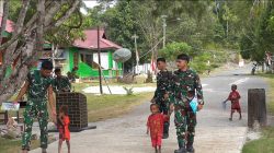 Senyum Anak-Anak Warnai Hasil Pembangunan Jalan Cor 250 Meter TMMD Ke-129 di Kampung Sesor